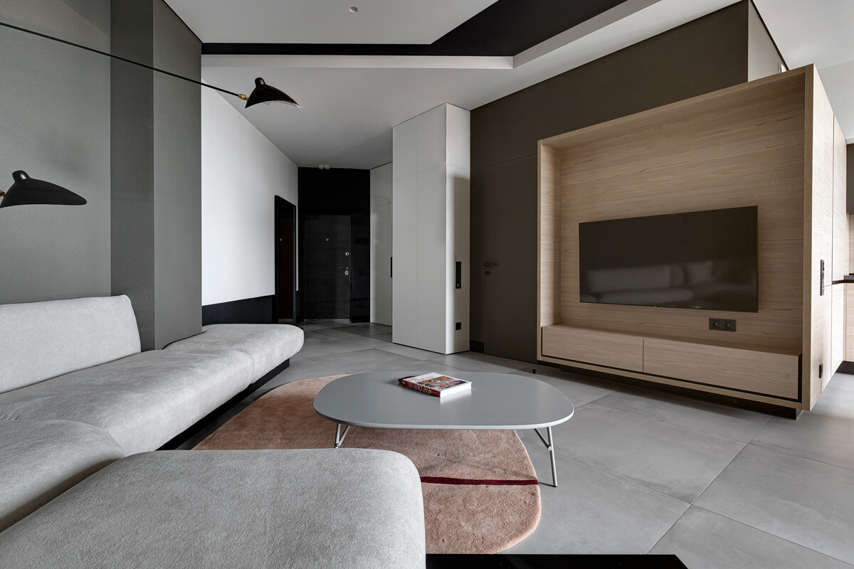 Drewno w salonie Salon w stylu nowoczesnym z elementami naturalnego drewna i tekstyliów.