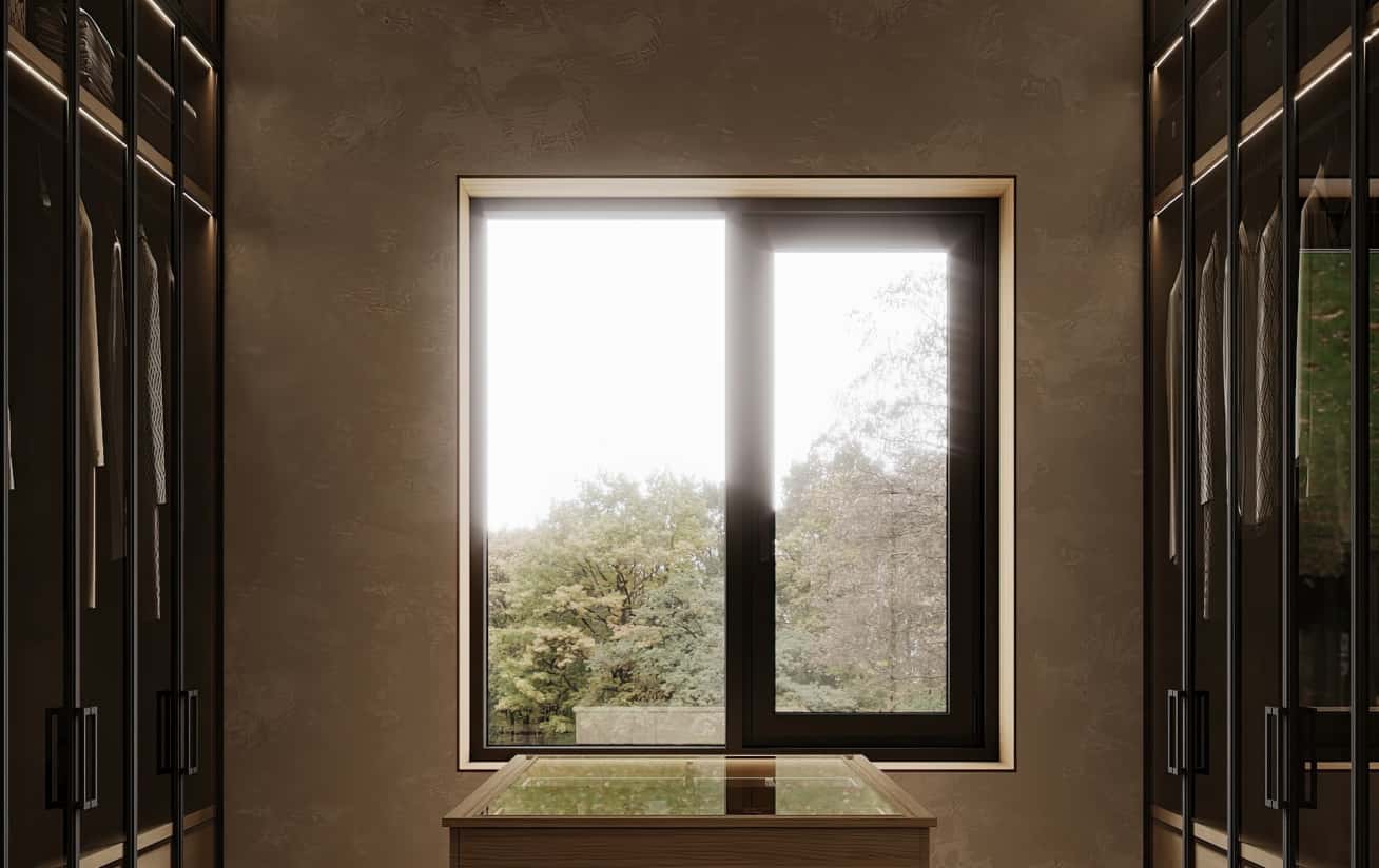 Światło i natura Projektowanie wnętrz 2026: Duże okna doświetlają naturalne wnętrze domu, tworząc spójność z naturą.