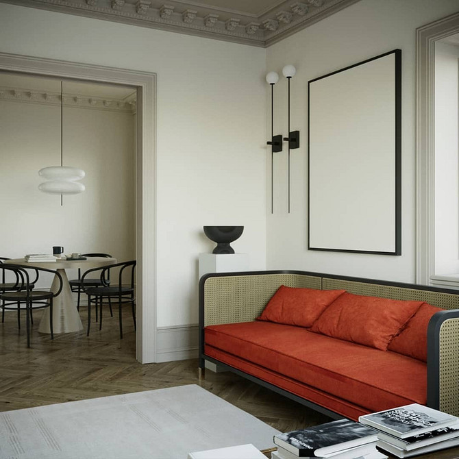 Aksamitna sofa w salonie Aksamitna, kolorowa sofa w małym mieszkaniu. Aranżacja wnętrz z sofą.