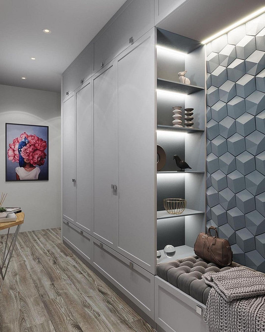 Minimalizm w przedpokoju Minimalistyczna szafa do przedpokoju w jasnych kolorach z gładkimi frontami. Ukryte fronty 2026.