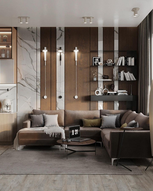 Salon z brązową sofą Nowoczesny salon z dużym brązowym диванem i stolikiem kawowym. Przestronne i stylowe wnętrze.