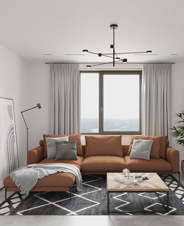 Elegancja brązu Elegancka brązowa sofa w przestronnym salonie. Klasyczny wystrój wnętrza.