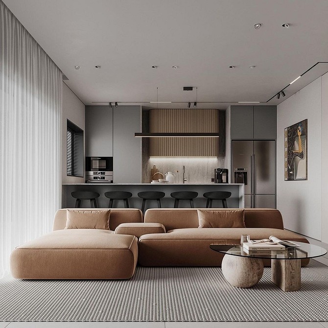 Kącik czytelniczy Dwuosobowa brązowa sofa w małym salonie z regałami na książki. Przytulne miejsce do czytania.