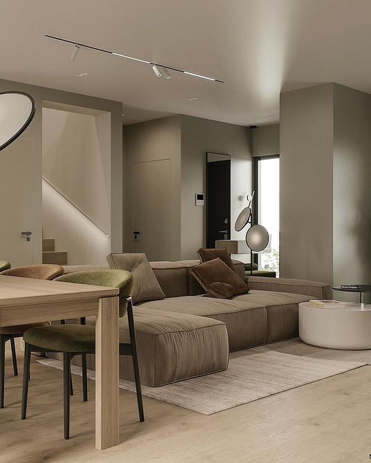 Salon z brązową sofą Projekt salonu z brązową sofą: stworzenie przytulnej i komfortowej przestrzeni.