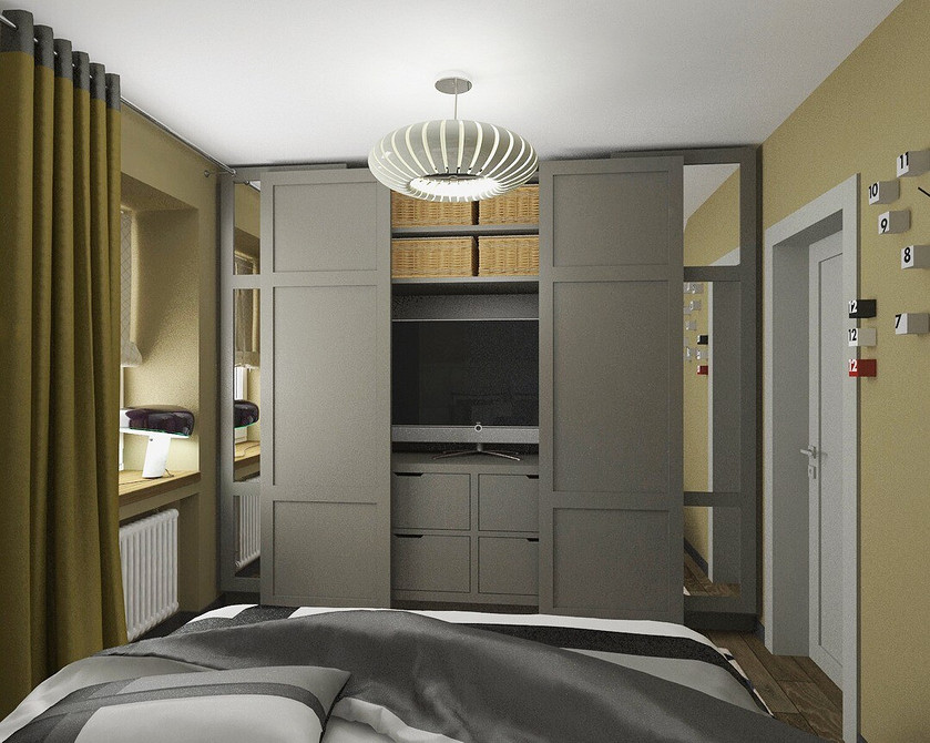 Klasyczna elegancja Klasyczny design: telewizor w szafie z neutralnymi kolorami i ozdobnymi listwami.