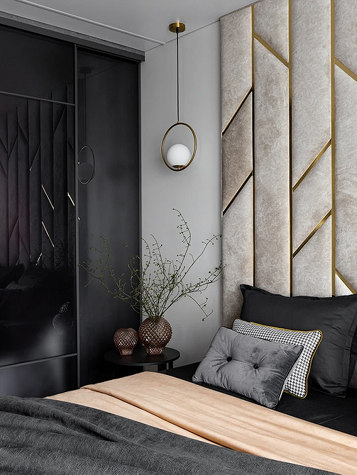 Szare łóżko i minimalizm Minimalistyczna sypialnia z szarym łóżkiem, białymi ścianami i drewnianą podłogą.