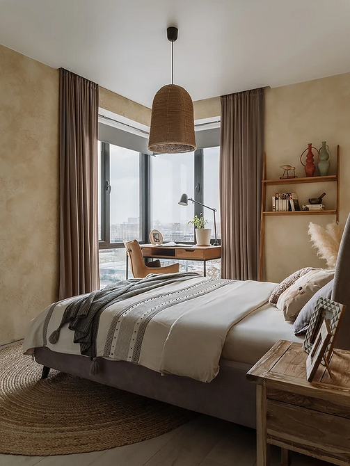 Elegancja w szarości Szare odcienie sypialni z eleganckim szarym łóżkiem i dywanem na podłodze.