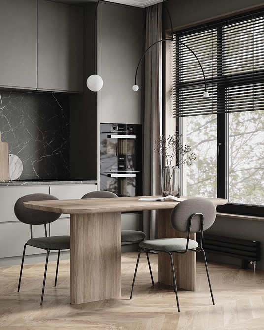 Szarość i aksamit Szare meble w minimalistycznym salonie. Aksamitne obicie dodaje elegancji małemu mieszkaniu.