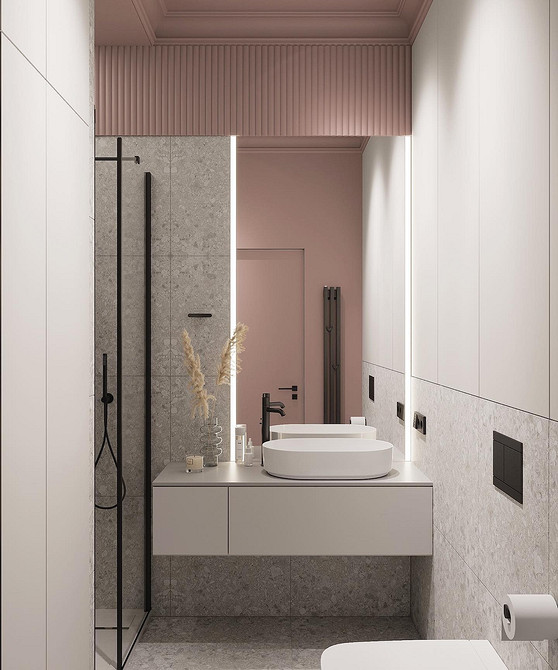 Szara harmonia w łazience Stylowa łazienka: szare płytki i szafka pod umywalkę tworzą spójną całość.