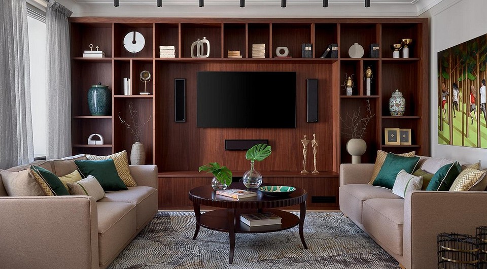 Biel i nowoczesność Biała szafka RTV w nowoczesnym salonie z stylowymi dekoracjami.