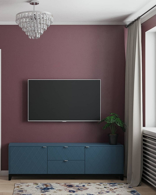 Szafka RTV LED Szafka RTV z podświetleniem LED tworzy przytulną atmosferę w salonie wieczorem.