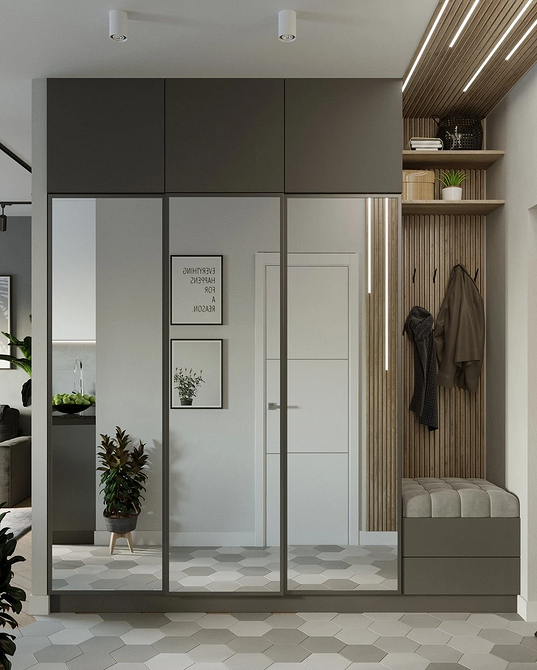 Matowe lustro w szafie Lustrzana szafa z matowym szkłem: nowoczesny design i przyjemne oświetlenie w salonie.