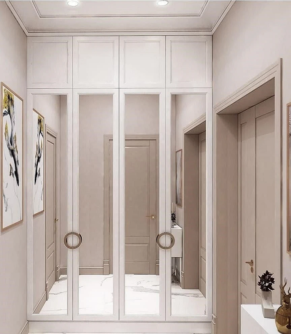 Salon z szafą lustrzaną Aranżacja salonu z szafą lustrzaną: funkcjonalność i estetyczny wygląd. Trend 2026.