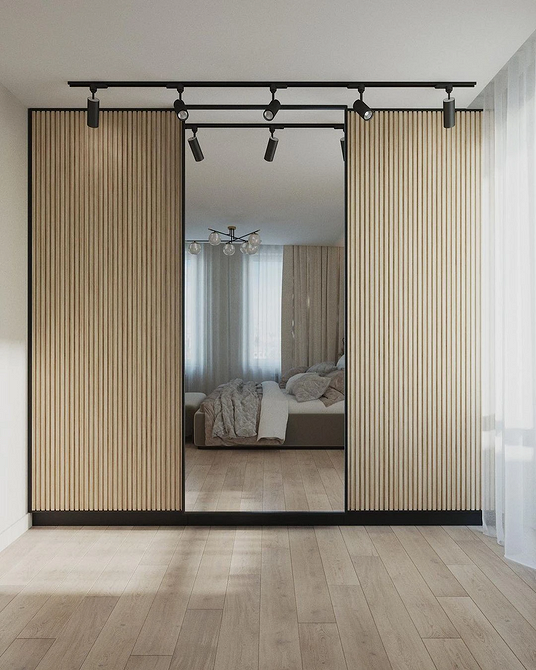 Szafa: Kombinacja luster Szafa przesuwna z lustrem i płytą wiórową, kombinacja materiałów.